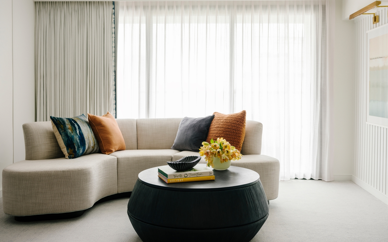 a modern round sofa and coffee table