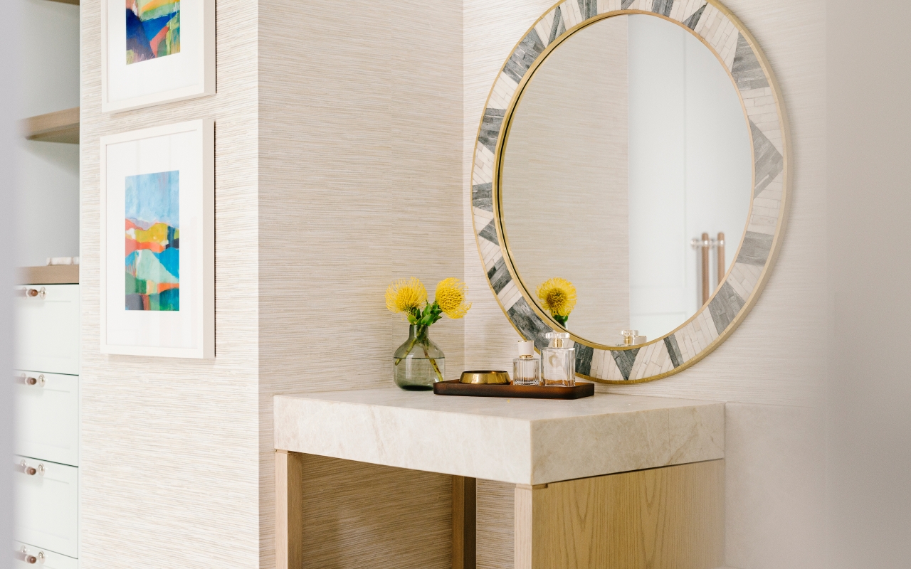 a beautiful mosaic tiled mirror above a vanity