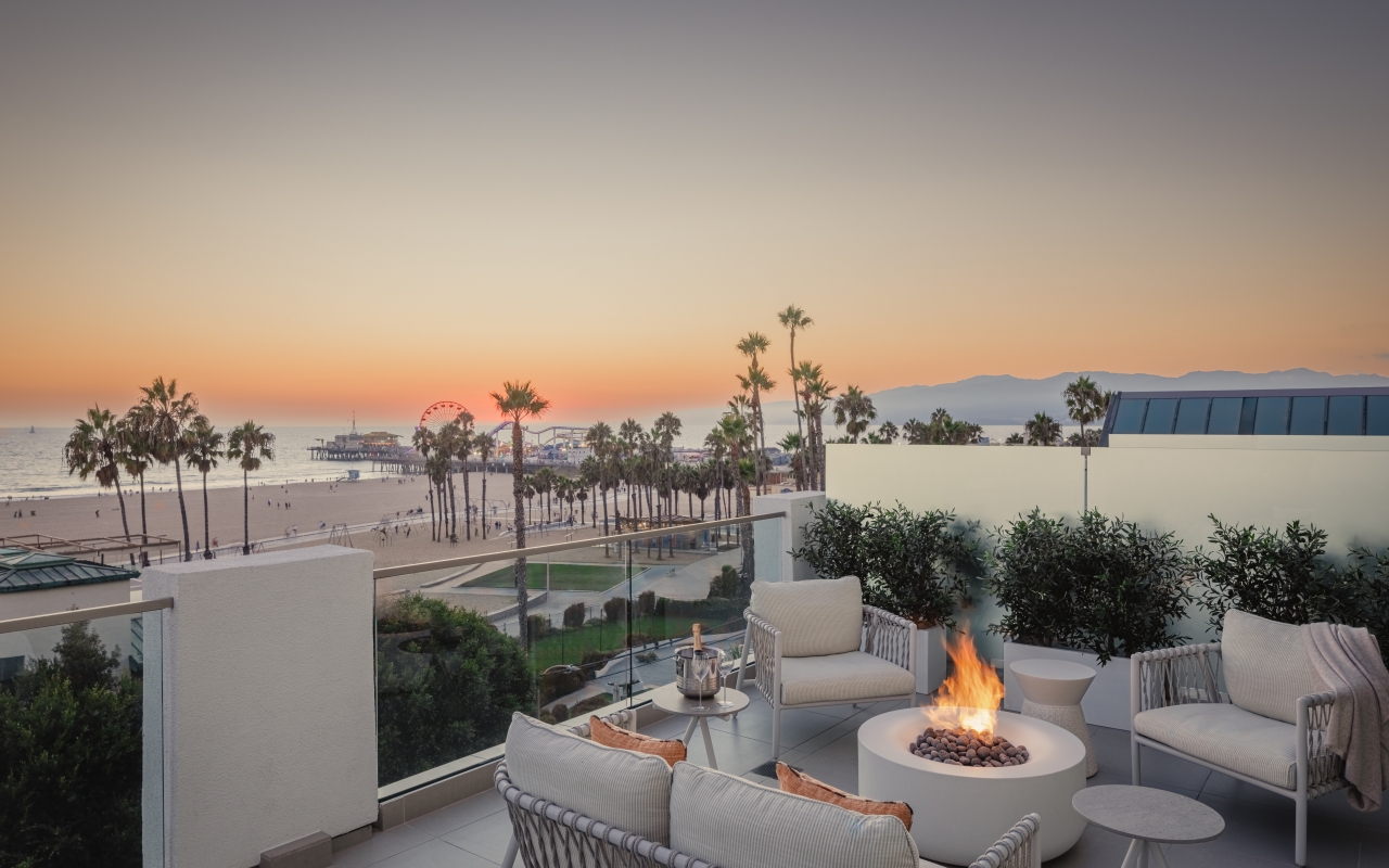 Regent Santa Monica Resort rooftop during sunset, with ocean view