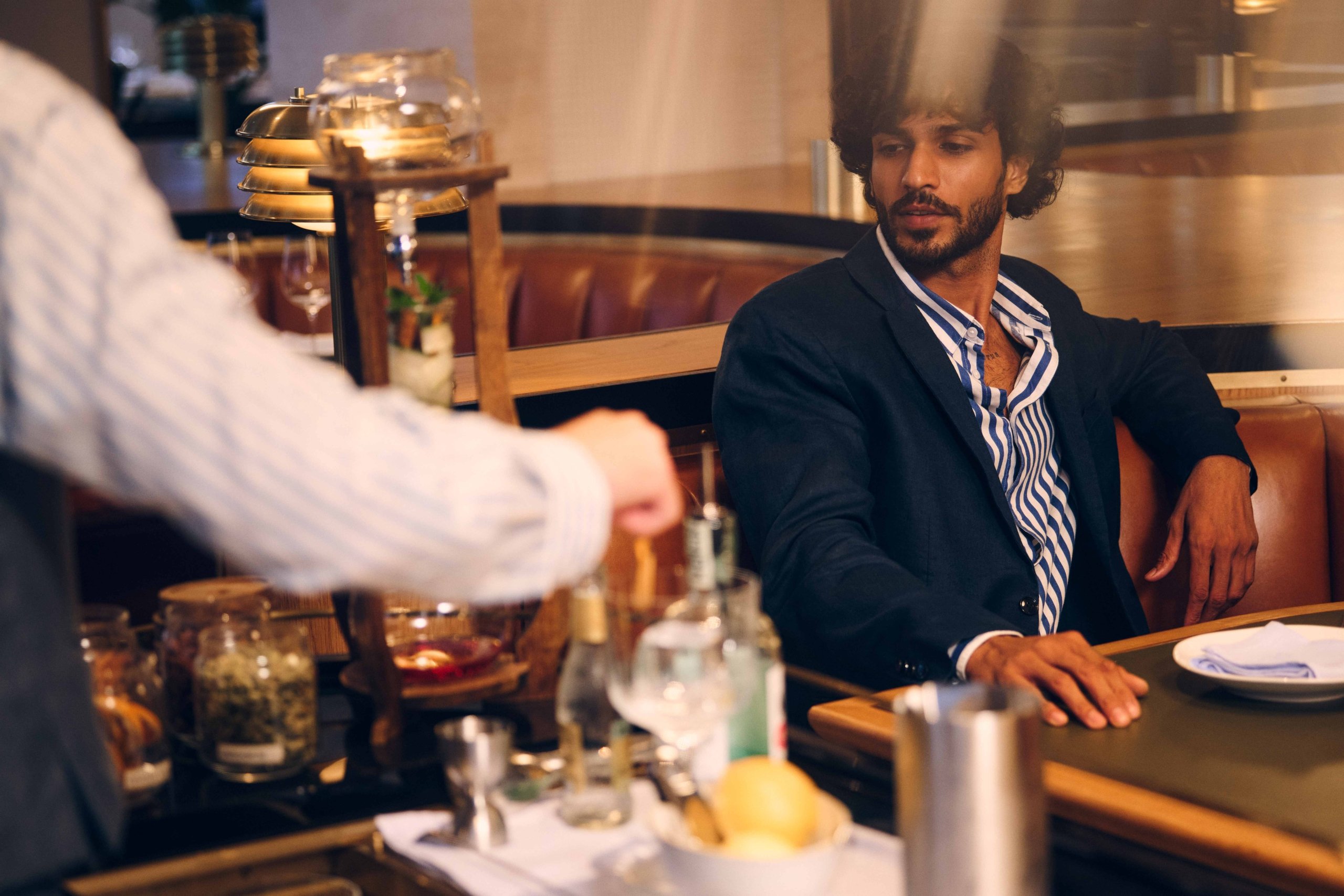 man being served cocktails during Valentine's Day