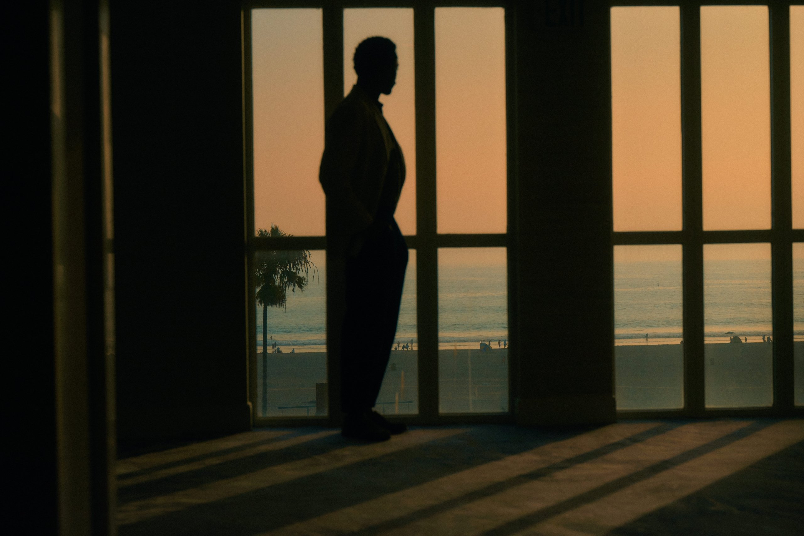 Man in lobby during sunset