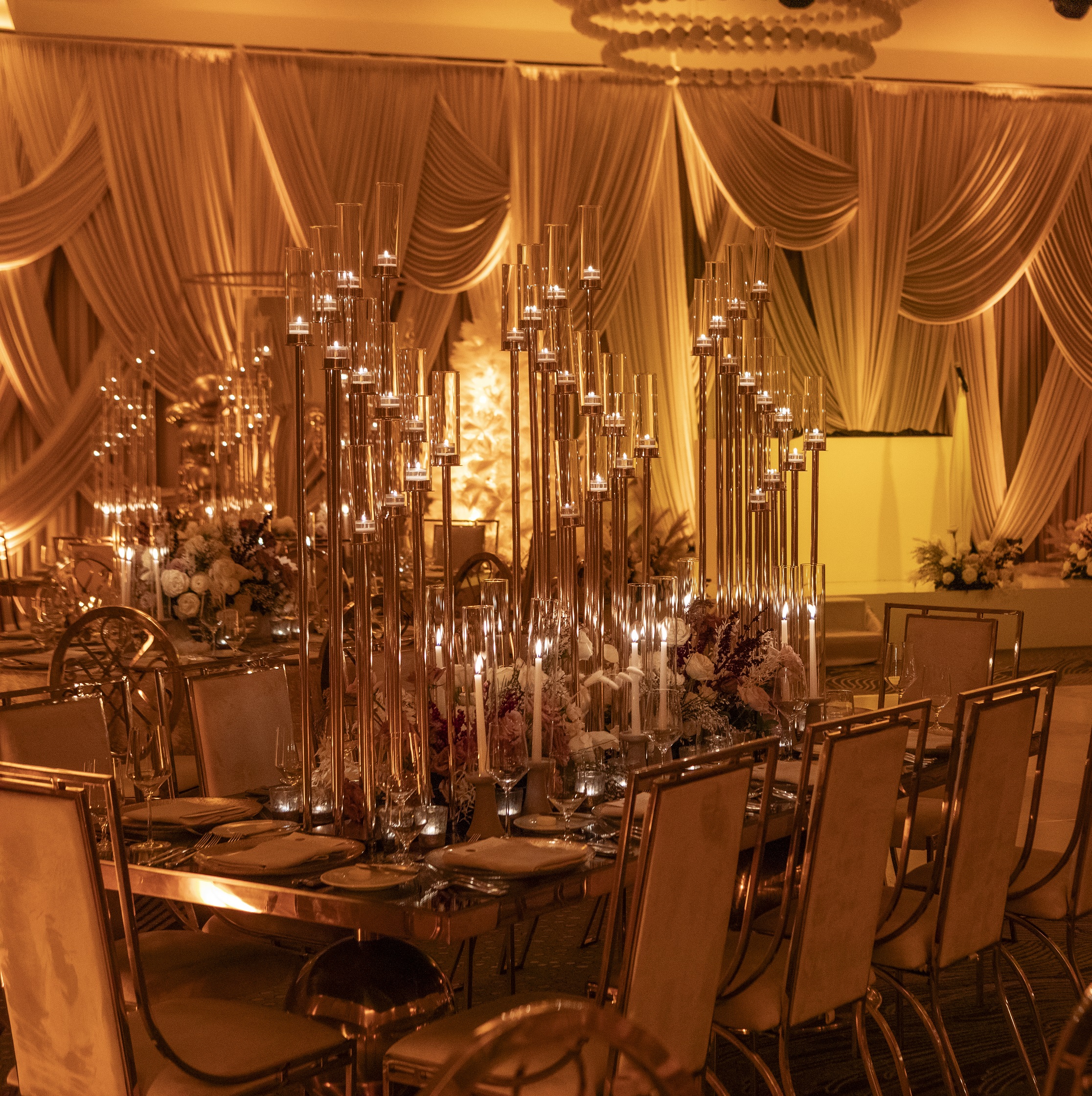 wedding table decorated with tall candles