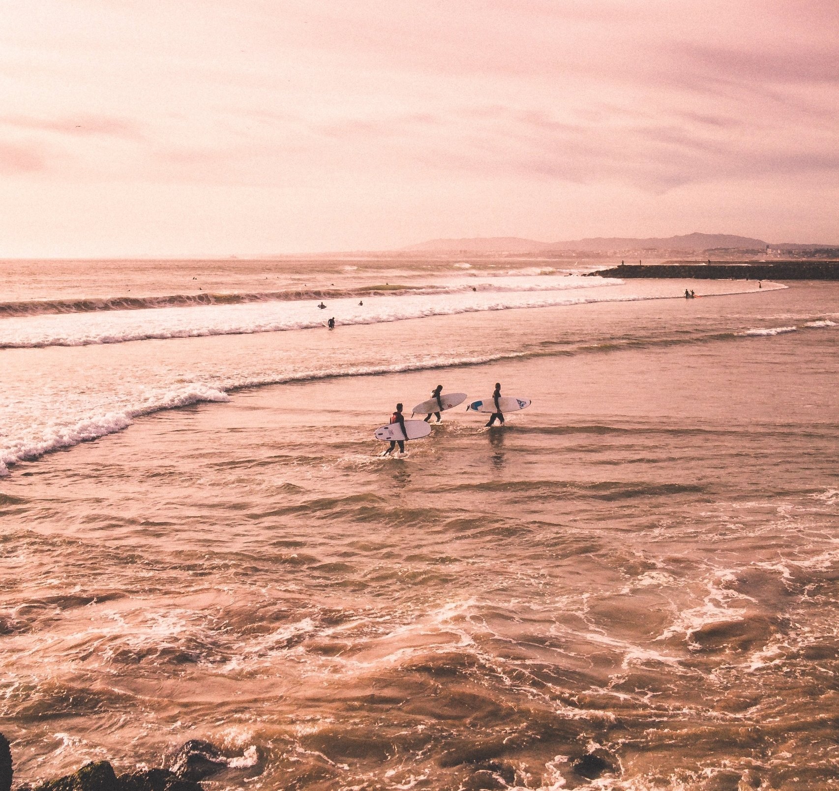 Surfers during sunrise in Sanata Monica