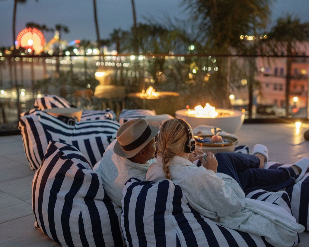 People watching movies on the big screen by the beach